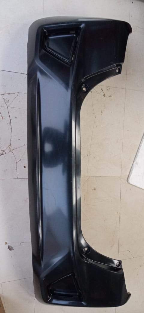 Honda Jazz rear bumper in black, showing the smooth exterior and mounting points for vehicle protection and style.