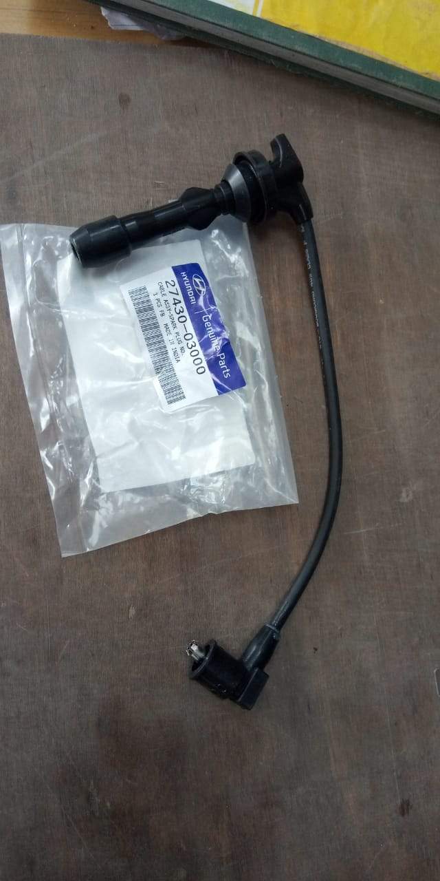 Hyundai plug wire for Xcent petrol or i10 Kapa 2, spare automotive parts, close-up view showing wiring and connectors.