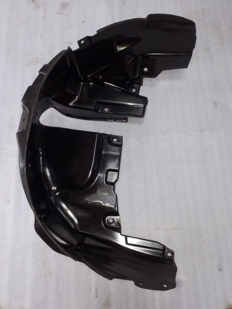 Maruti Suzuki Dezire rear fender lining on the left side, automotive body part for vehicle protection and fitment.