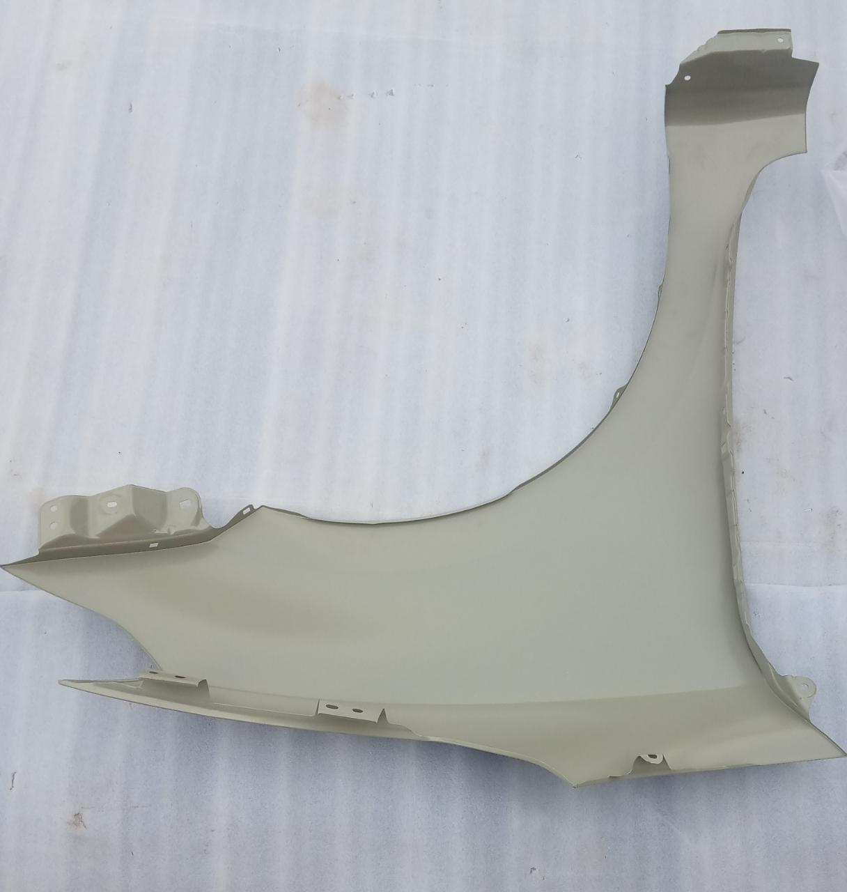 Maruti Suzuki front fender panel for Swift, showcasing the sleek exterior design and smooth finish of the car part.