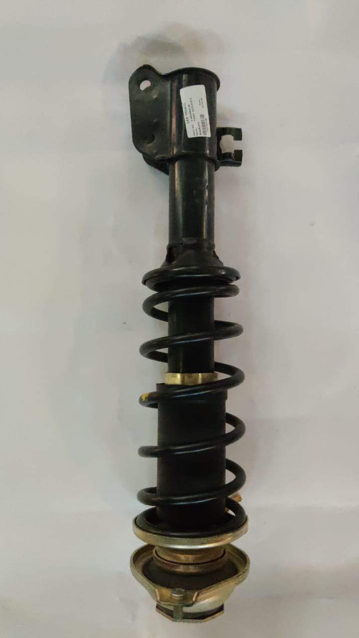 Maruti Suzuki Alto K10 front left shock absorber showing the complete shock unit for vehicle suspension.