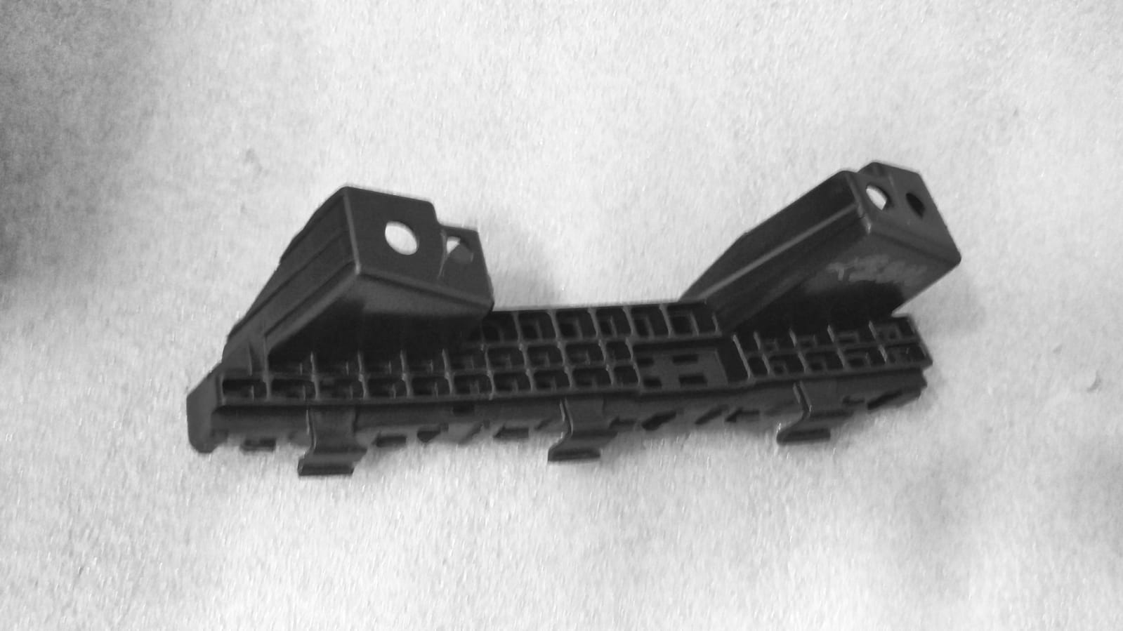 Maruti Suzuki Vitara Brezza front bumper holder part, LH side, automotive component for vehicle repair or replacement.