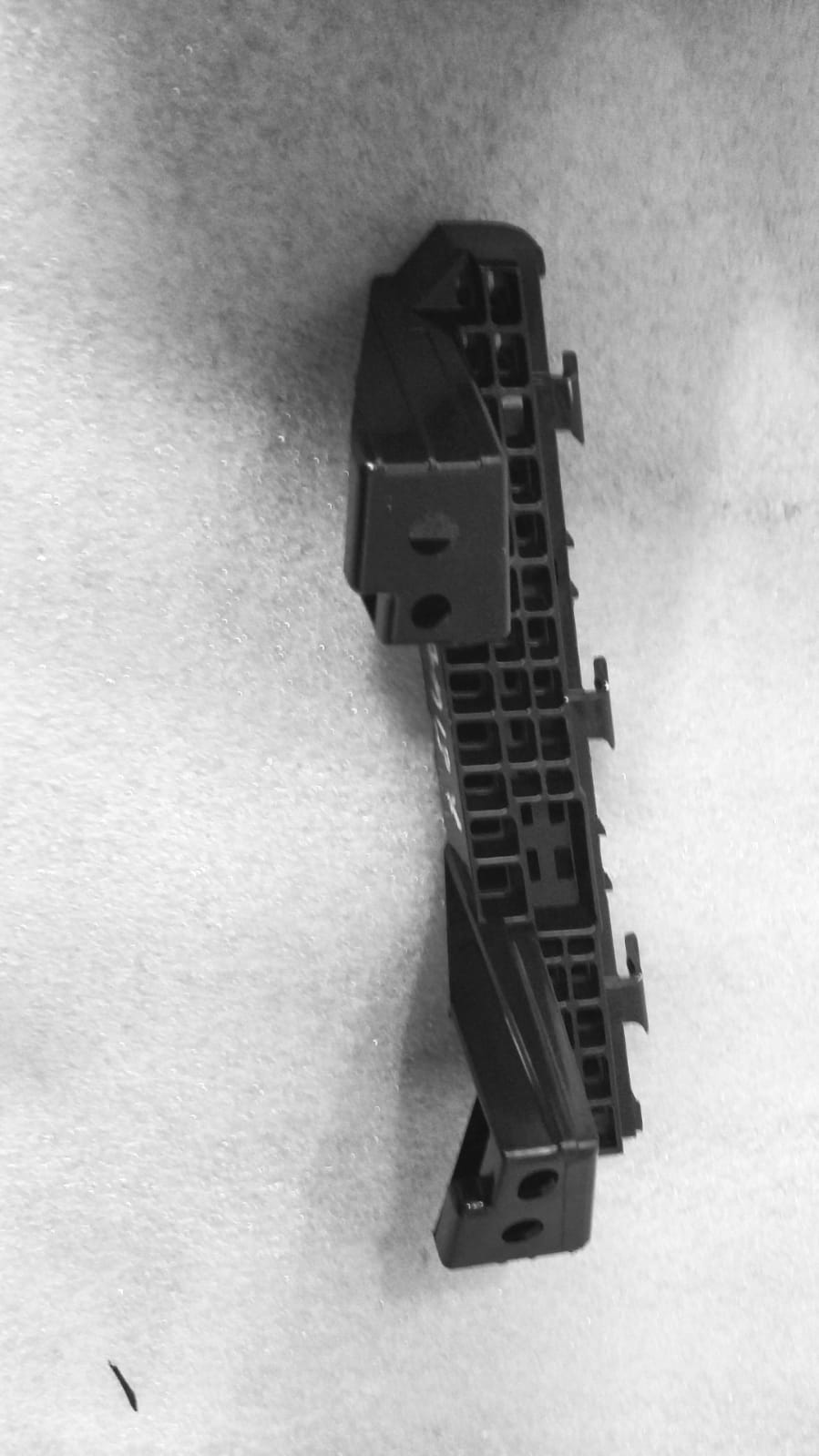 Maruti Suzuki HOLDERFR BUMPER FRONT 71733M82P00 showing a close-up of the front bumper part for a Maruti Suzuki vehicle