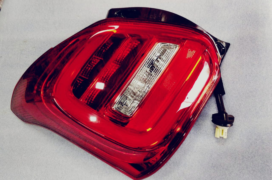 Maruti Suzuki lamp unit RR comb LH 35750M55RA0, vehicle lighting component for Maruti Suzuki cars, front left side.
