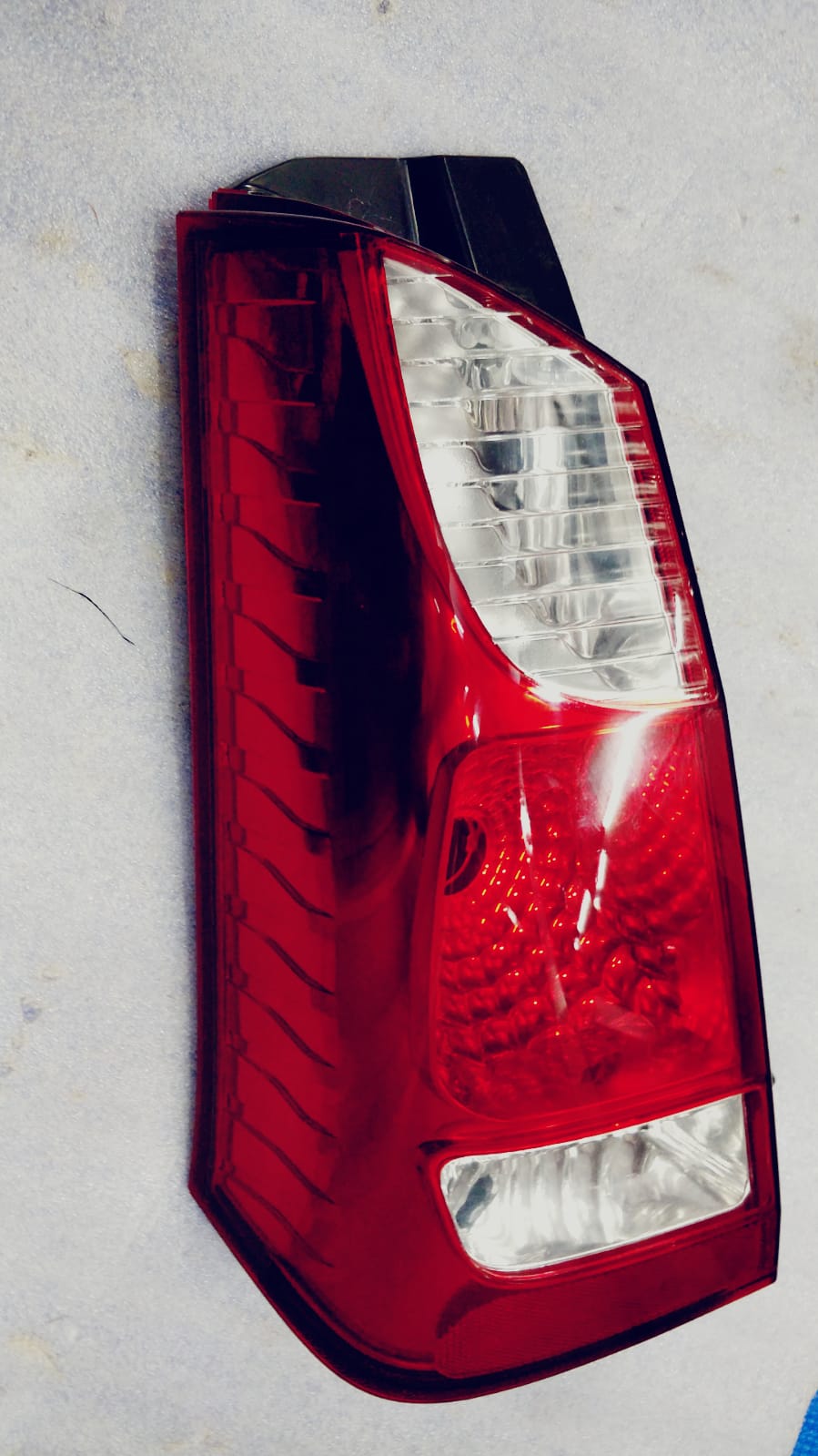 Maruti Suzuki lamp unit RR combination LH for vehicle, featuring clear lens and mounting points, part number 35750M67L00