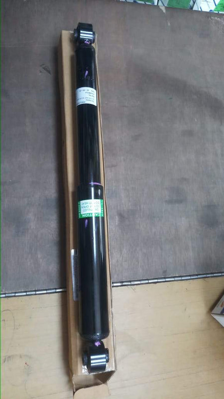 Maruti Suzuki Wagon R rear shocker Stingray model, automotive suspension component, with black coil spring and shock absorber.