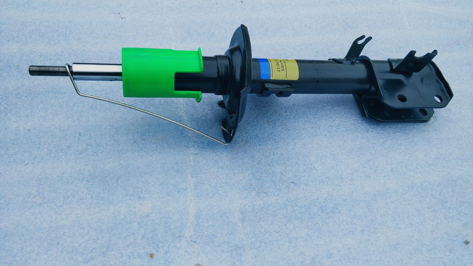 Maruti Suzuki front right suspension strut assembly with part number 41601M60M01, showing the shock absorber and mounting components