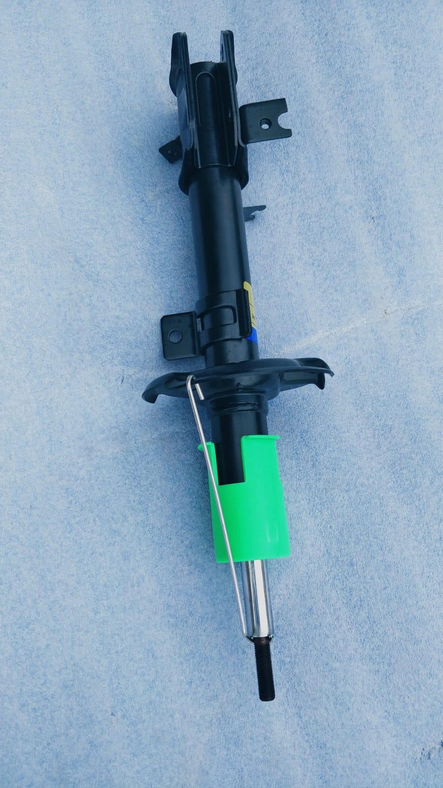 Maruti Suzuki front suspension strut assembly, part number 41602M60M01, showing the vehicle suspension component.