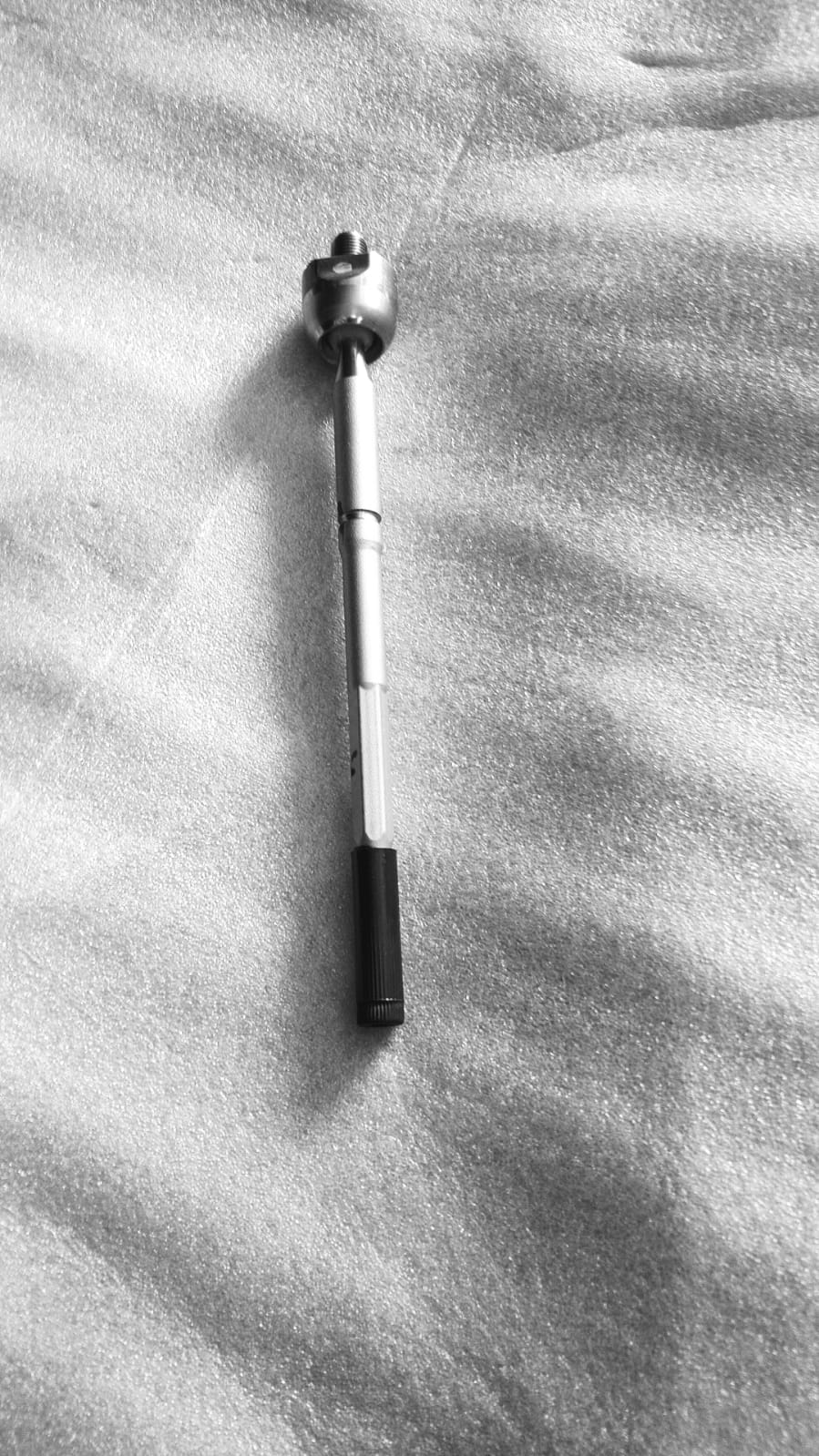 Maruti Suzuki tie rod component, part number 48830M68K00, for steering system repair on Maruti Suzuki vehicles.