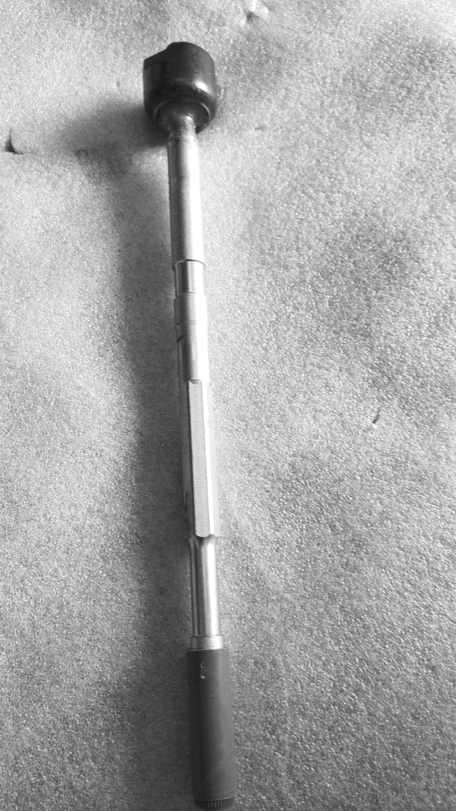 Maruti Suzuki tie rod assembly part 48830M68P00, close-up of the steering component for vehicle stability and control.