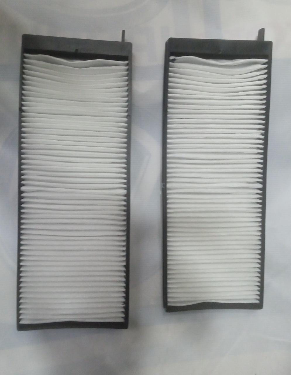 Minda cabin air filter for Mahindra XUV500, model CF7018, showing the filter element designed for vehicle air purification