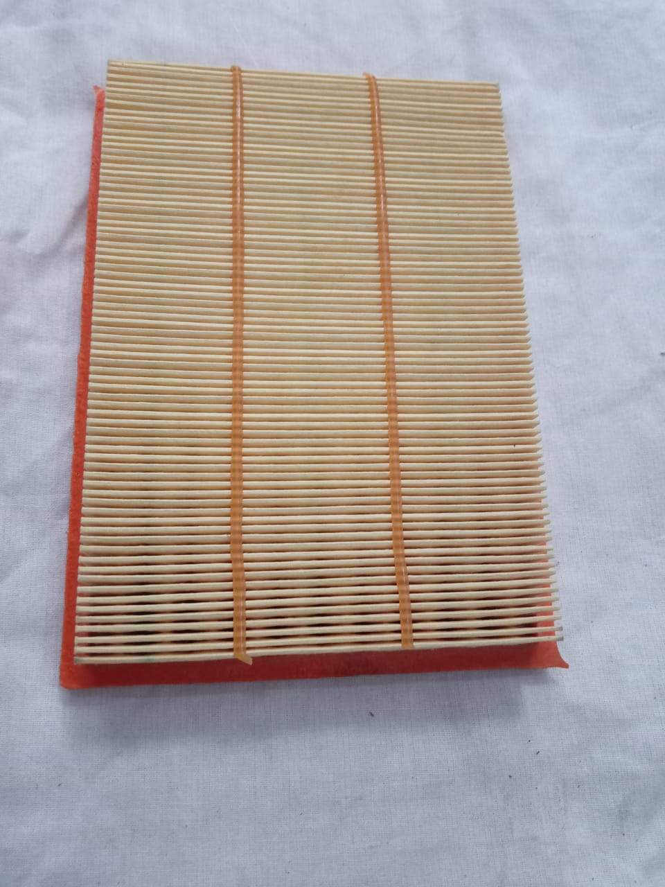 Nissan air filter element model 165461HC2A, replacement car air filter showing the clean filter material and frame.