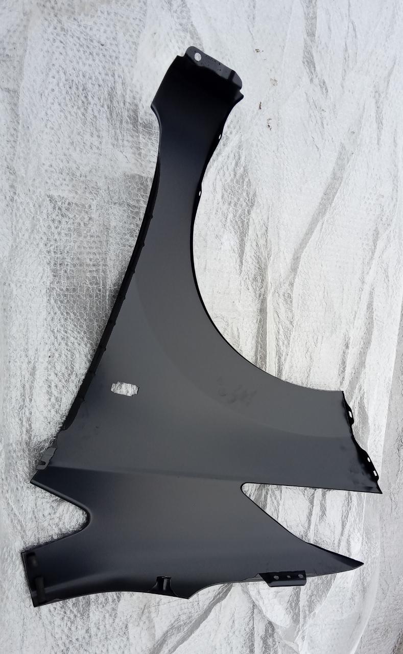 Nissan Datsun Ready Go right fender, black automotive replacement part for Nissan Datsun models, positioned on vehicle.