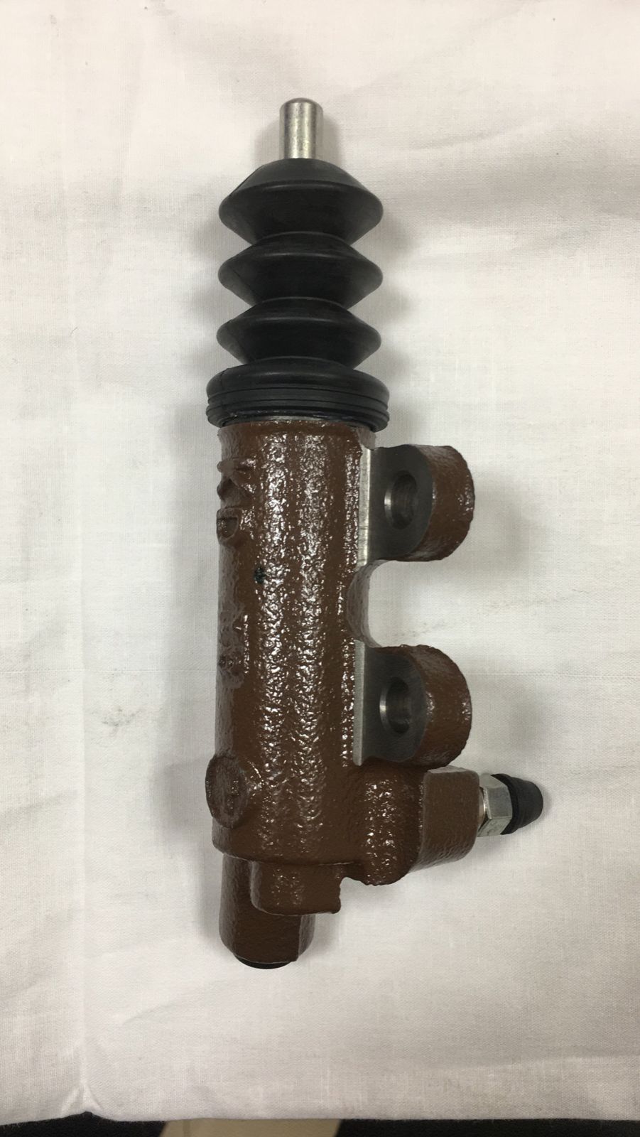 Toyota Fortuner clutch sleeve cylinder, genuine OEM part with black metal finish and detailed design for clutch system repair.