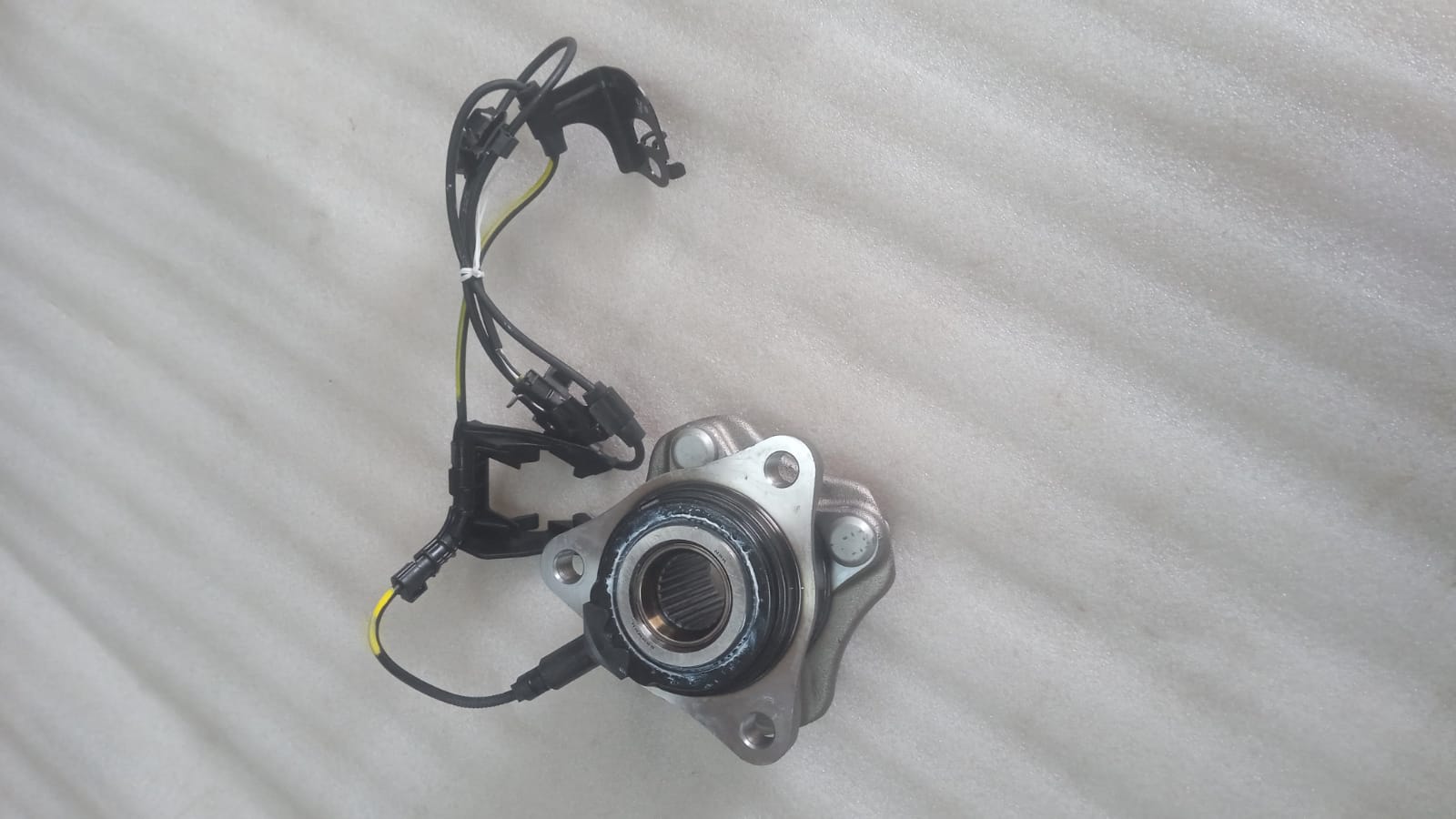 Toyota Etios front right wheel hub assembly, close-up view of the automotive part with mounting details.