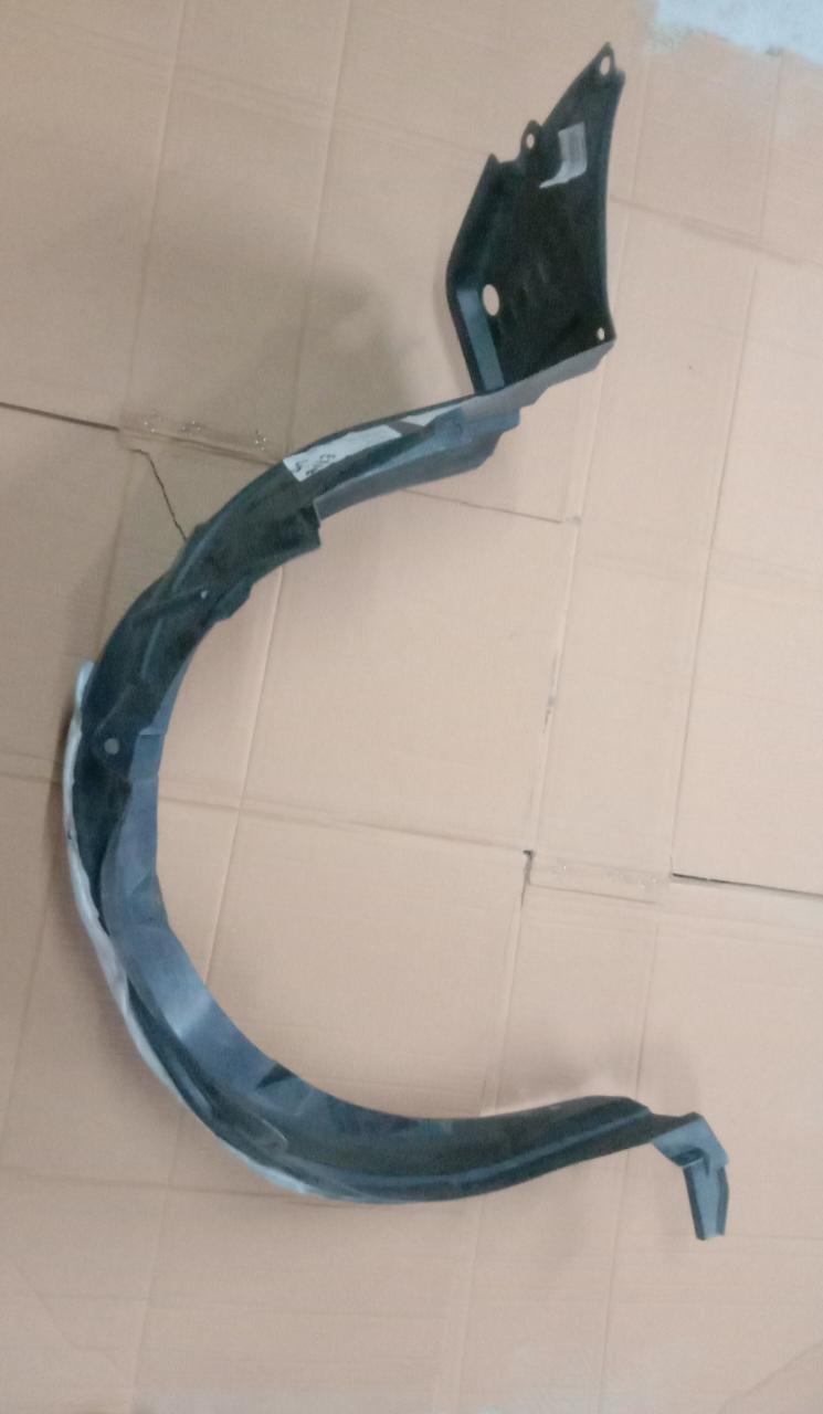 Toyota Etios front fender lining left side, black plastic component for vehicle protection and wheel arch coverage.