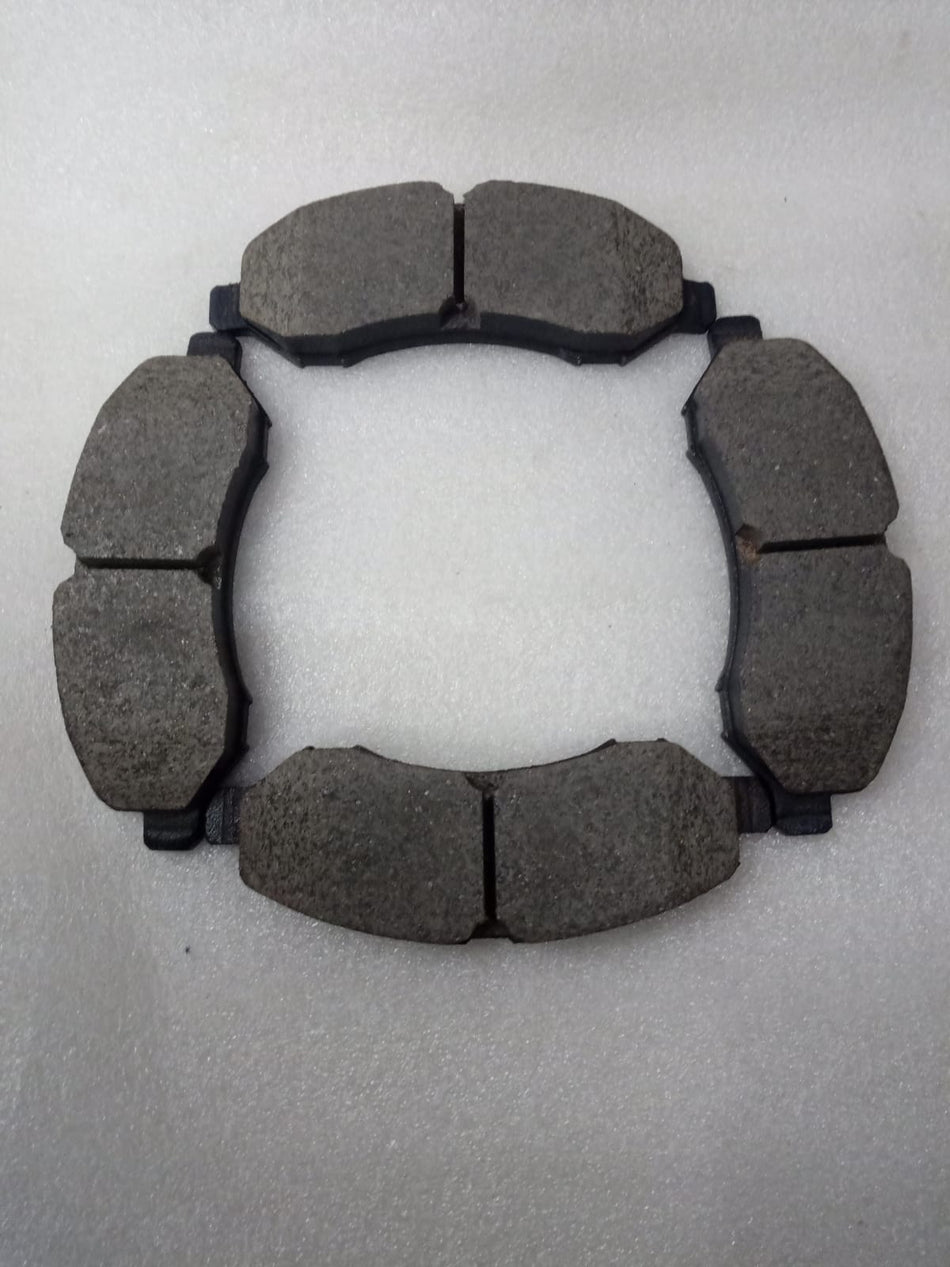 TVS Tiago front side brake pad, spare part with metal and friction surface visible, designed for vehicle safety and braking performance.