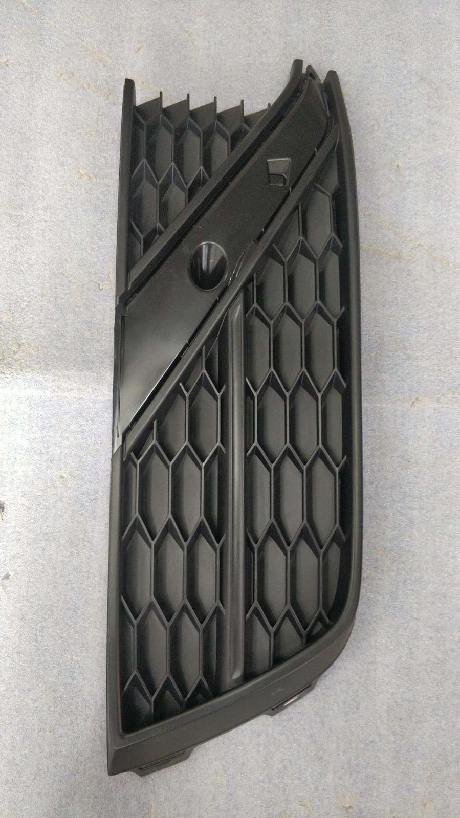 Volkswagen grille 6RG853665L for Volkswagen vehicles, showing the front grille design with black accents and chrome trim.